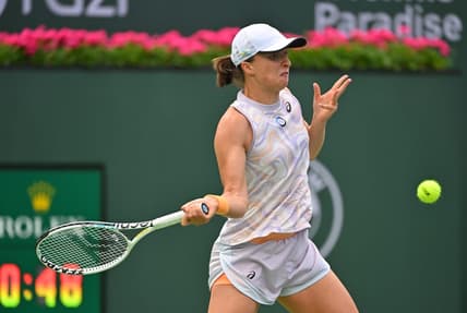 Mar 11, 2023; Indian Wells, CA, USA;  Iga Swiatek (POL) hits a shot as she won her second round match against Claire Liu (USA) in the BNP Paribas Open at the Indian Wells Tennis Garden. Mandatory Credit: Jayne Kamin-Oncea-USA TODAY Sports