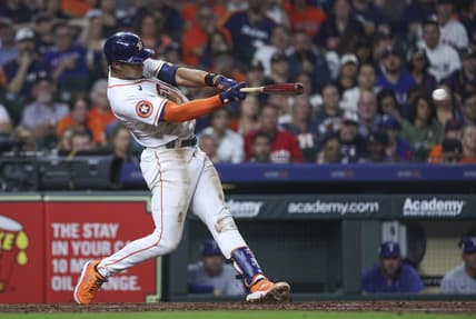 Apr 15, 2023; Houston, Texas, USA; Houston Astros shortstop Jeremy Pena hits an RBI double during the seventh inning against the Texas Rangers at Minute Maid Park. Mandatory Credit: Troy Taormina-USA TODAY Sports