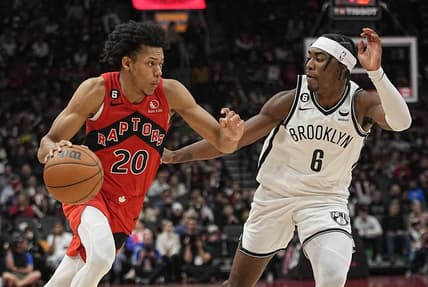 Nov 23, 2022; Toronto, Ontario, CAN; Toronto Raptors guard Jeff Dowtin (20) drives to the net against Brooklyn Nets forward David Duke Jr. (6) during the second half at Scotiabank Arena. Mandatory Credit: John E. Sokolowski-USA TODAY Sports