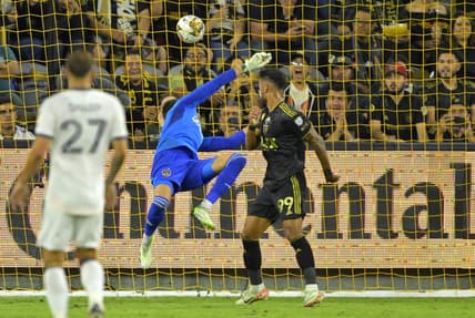 Sep 16, 2023; Los Angeles, California, USA;  Los Angeles FC forward Denis Bouanga (99) scores a goal past Los Angeles Galaxy goalkeeper Jonathan Bond (1) off a pass by Los Angeles Galaxy forward Michael Barrios (12) in the first half at BMO Stadium. Mandatory Credit: Jayne Kamin-Oncea-USA TODAY Sports