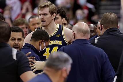 Feb 20, 2022; Madison, WI, USA; Wisconsin head coach Greg Gard, right, is involved in a scuffle with Michigan head coach Juwan Howard during the waning moments of their game Sunday, February 20, 2022 at the Kohl Center in Madison, Wis. Wisconsin beat Michigan 77-63.  Mandatory Credit: Mark Hoffman-USA TODAY Sports