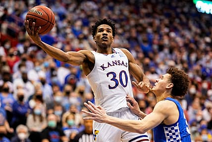 Jan 29, 2022; Lawrence, Kansas, USA; Kansas Jayhawks guard Ochai Agbaji (30) shoots against Kentucky Wildcats guard Kellan Grady (31) during the second half at Allen Fieldhouse. Mandatory Credit: Jay Biggerstaff-USA TODAY Sports