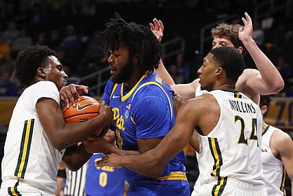 Nov 25, 2022; Pittsburgh, Pennsylvania, USA; William & Mary Tribe guard Gabe Dorsey (left) and Pittsburgh Panthers forward John Hugley IV (4) battle for the ball during the first half at Petersen Events Center. Mandatory Credit: Charles LeClaire-USA TODAY Sports
