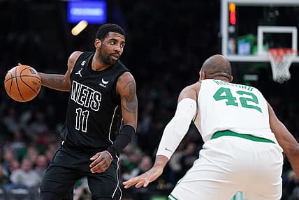 Feb 1, 2023; Boston, Massachusetts, USA; Brooklyn Nets guard Kyrie Irving (11) returns the ball against Boston Celtics center Al Horford (42) in the second half at TD Garden. Mandatory Credit: David Butler II-USA TODAY Sports