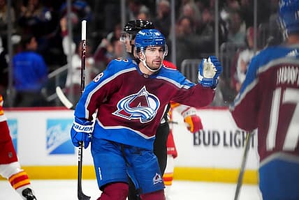 Feb 25, 2023; Denver, Colorado, USA; Colorado Avalanche center Alex Newhook (18) celebrates his goal in the first period against the Colorado Avalanche at Ball Arena. Mandatory Credit: Ron Chenoy-USA TODAY Sports