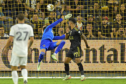 Sep 16, 2023; Los Angeles, California, USA;  Los Angeles FC forward Denis Bouanga (99) scores a goal past Los Angeles Galaxy goalkeeper Jonathan Bond (1) off a pass by Los Angeles Galaxy forward Michael Barrios (12) in the first half at BMO Stadium. Mandatory Credit: Jayne Kamin-Oncea-USA TODAY Sports