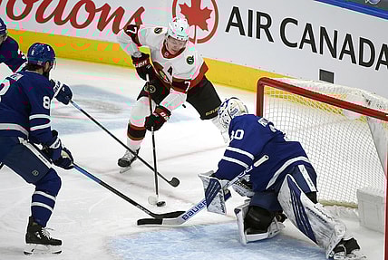 Feb 18, 2021; Toronto, Ontario, CAN;  Ottawa Senators forward Brady Tkachuk (7) shoots the puck as Toronto Maple Leafs goalie Michael Hutchinson (30) defends in the first period at Scotiabank Arena. Mandatory Credit: Dan Hamilton-USA TODAY Sports