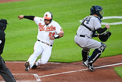 Apr 26, 2021; Baltimore, Maryland, USA; Baltimore Orioles catcher Pedro Severino (28) slides home to score a run during the second inning against the New York Yankees at Oriole Park at Camden Yards. Mandatory Credit: Evan Habeeb-USA TODAY Sports