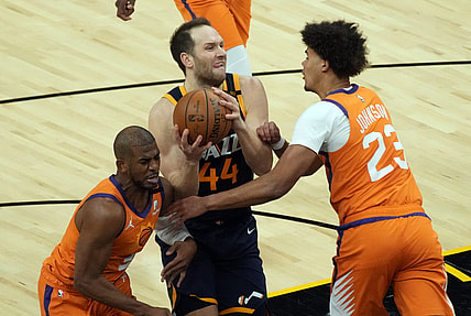 Apr 30, 2021; Phoenix, Arizona, USA; Utah Jazz forward Bojan Bogdanovic (44) drives between Phoenix Suns guard Chris Paul (3) and forward Cameron Johnson (23) in the first half at Phoenix Suns Arena. Mandatory Credit: Rick Scuteri-USA TODAY Sports