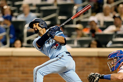 Jul 24, 2021; New York City, New York, USA; Toronto Blue Jays second baseman Marcus Semien (10) hits a three-run home run against the New York Mets during the fifth inning at Citi Field. Mandatory Credit: Andy Marlin-USA TODAY Sports