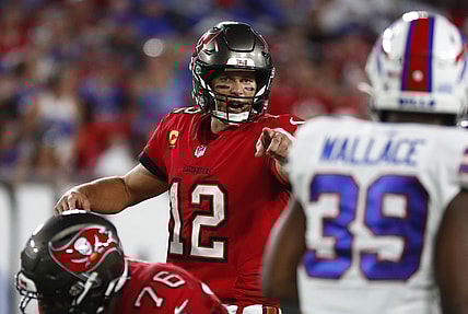 Dec 12, 2021; Tampa, Florida, USA;Tampa Bay Buccaneers quarterback Tom Brady (12) points against the Buffalo Bills  during the first half at Raymond James Stadium. Mandatory Credit: Kim Klement-USA TODAY Sports