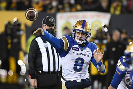 Dec 12, 2021; Hamilton, Ontario, CAN;   Winnipeg Blue Bombers quarterback Zach Collaros (8) throws a pass against Hamilton Tiger-Cats during the 108th Grey Cup football game at Tim Hortons Field. Mandatory Credit: Dan Hamilton-USA TODAY Sports