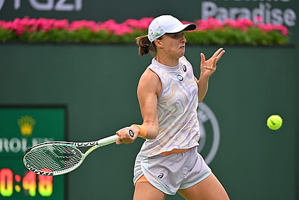 Mar 11, 2023; Indian Wells, CA, USA;  Iga Swiatek (POL) hits a shot as she won her second round match against Claire Liu (USA) in the BNP Paribas Open at the Indian Wells Tennis Garden. Mandatory Credit: Jayne Kamin-Oncea-USA TODAY Sports