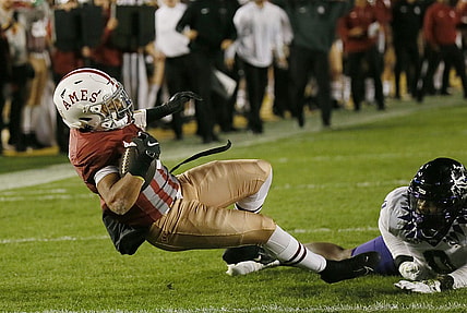 Iowa State Cyclones' running back Eli Sanders (6) breaks a tackle from TCU Horned Frogs' linebacker Shad Banks jR.(0) and drives for a touchdown during the first half in the Jack Trice Legacy Game at Jack Trice Stadium on Saturday, Oct. 7, 2023, in Ames, Iowa.