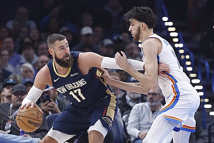 Nov 1, 2023; Oklahoma City, Oklahoma, USA; New Orleans Pelicans center Jonas Valanciunas (17) drives against Oklahoma City Thunder forward Chet Holmgren (7) during the first quarter at Paycom Center. Mandatory Credit: Alonzo Adams-USA TODAY Sports