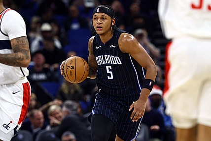 Nov 29, 2023; Orlando, Florida, USA; Orlando Magic forward Paolo Banchero (5) drives to the basket against the Washington Wizards during the first quarter at Amway Center. Mandatory Credit: Kim Klement Neitzel-USA TODAY Sports