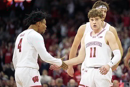 Jan 19, 2024; Madison, Wisconsin, USA; Wisconsin Badgers guard Max Klesmit (11) celebrates a three point basket with Wisconsin Badgers guard Kamari McGee (4) during the second half against the Indiana Hoosiers at the Kohl Center. Mandatory Credit: Kayla Wolf-USA TODAY Sports