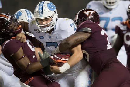 Oct 19, 2019; Blacksburg, VA, USA; North Carolina Tar Heels quarterback Sam Howell (7) is sacked on a two point conversion attempt against the Virginia Tech Hokies in overtime at Lane Stadium. Mandatory Credit: Lee Luther Jr.-USA TODAY Sports