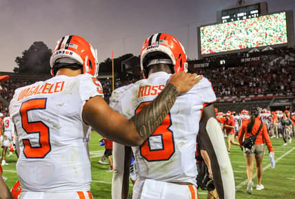 Clemson wide receiver Justyn Ross (8) is consoled by quarterback D.J. Uiagalelei (5) after the Tigers lost 27-21 in two overtimes on Saturday in Raleigh, N.C.

Ncaa Football Clemson At Nc State