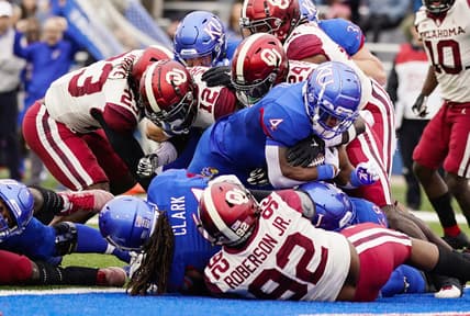 Oct 23, 2021; Lawrence, Kansas, USA; Kansas Jayhawks running back Devin Neal (4) scores a touchdown against the Oklahoma Sooners during the first half at David Booth Kansas Memorial Stadium. Mandatory Credit: Jay Biggerstaff-USA TODAY Sports