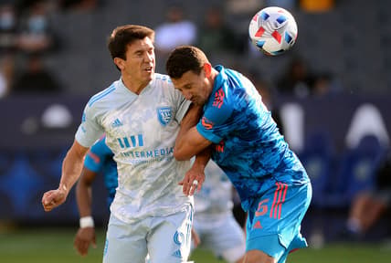 May 29, 2021; Carson, California, USA; San Jose Earthquakes midfielder Shea Salinas (6) plays for the ball against Los Angeles Galaxy defender Daniel Steres (5) during the second half at Dignity Health Sports Park. Mandatory Credit: Gary A. Vasquez-USA TODAY Sports