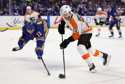 Jan 22, 2022; Buffalo, New York, USA;  Buffalo Sabres defenseman Mark Pysyk (13) tries to block a shot by Philadelphia Flyers center Scott Laughton (21) during the first period at KeyBank Center. Mandatory Credit: Timothy T. Ludwig-USA TODAY Sports
