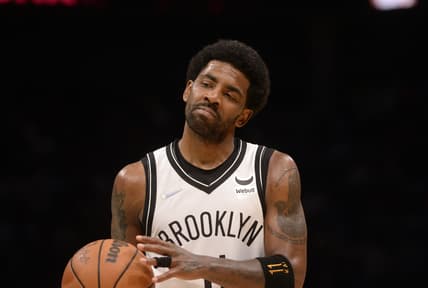 Mar 8, 2022; Charlotte, North Carolina, USA;  Brooklyn Nets guard Kyrie Irving (11) reacts after scoring during the second half against the Charlotte Hornets at the Spectrum Center. Mandatory Credit: Sam Sharpe-USA TODAY Sports