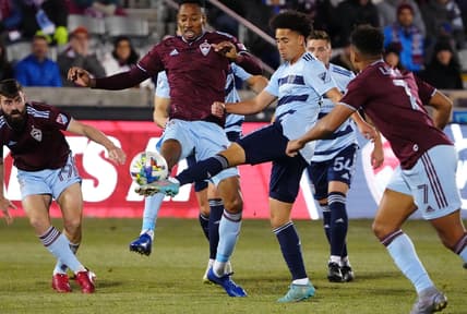 Mar 12, 2022; Commerce City, Colorado, USA; Sporting Kansas City midfielder Cameron Duke (28) and Colorado Rapids midfielder Mark-Anthony Kaye (14) reach for the ball in the first half at Dick's Sporting Goods Park. Mandatory Credit: Ron Chenoy-USA TODAY Sports