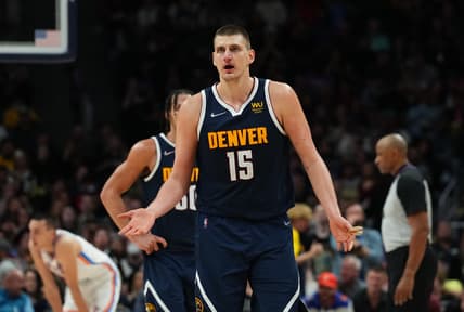 Mar 26, 2022; Denver, Colorado, USA; Denver Nuggets center Nikola Jokic (15) reacts in the second half against the Oklahoma City Thunder at Ball Arena. Mandatory Credit: Ron Chenoy-USA TODAY Sports