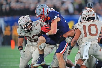 Dec 11, 2021; East Rutherford, New Jersey, USA; Navy Midshipmen fullback Isaac Ruoss (32) carries the ball against the Army Black Knights during the second half of the 122nd Army-Navy game. Mandatory Credit: Danny Wild-USA TODAY Sports