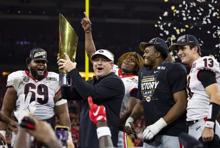Jan 10, 2022; Indianapolis, IN, USA; Georgia Bulldogs head coach Kirby Smart celebrates with the championship trophy after defeating the Alabama Crimson Tide in the 2022 CFP college football national championship game at Lucas Oil Stadium. Mandatory Credit: Mark J. Rebilas-USA TODAY Sports