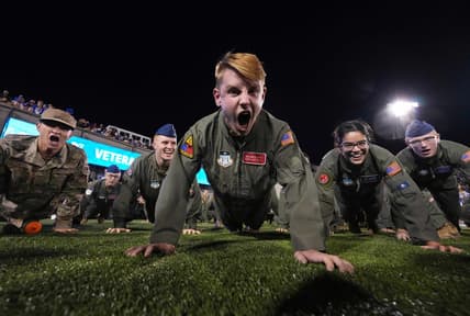 Sep 23, 2022; Colorado Springs, Colorado, USA; Air Force cadets finish pushups following a score in the second quarter against the Nevada Wolf Pack at Falcon Stadium. Mandatory Credit: Ron Chenoy-USA TODAY Sports