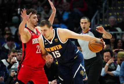 Nov 28, 2022; Denver, Colorado, USA; Denver Nuggets center Nikola Jokic (15) drives at Houston Rockets center Alperen Sengun (28) in the third quarter at Ball Arena. Mandatory Credit: Ron Chenoy-USA TODAY Sports
