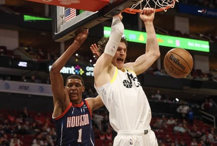 Jan 5, 2023; Houston, Texas, USA;  Utah Jazz forward Lauri Markkanen (23) dunks against Houston Rockets forward Jabari Smith Jr. (1) at Toyota Center. Mandatory Credit: Thomas Shea-USA TODAY Sports