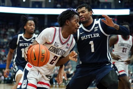 Jan 22, 2023; Hartford, Connecticut, USA; UConn Huskies guard Tristen Newton (2) drives the ball against Butler Bulldogs forward Jalen Thomas (1) in the first half at XL Center. Mandatory Credit: David Butler II-USA TODAY Sports