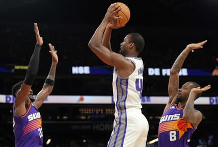 Mar 11, 2023; Phoenix, Arizona, USA; Sacramento Kings forward Harrison Barnes (40) shoots over Phoenix Suns center Deandre Ayton (22) and Phoenix Suns guard Terrence Ross (8) during the first half at Footprint Center. Mandatory Credit: Joe Camporeale-USA TODAY Sports