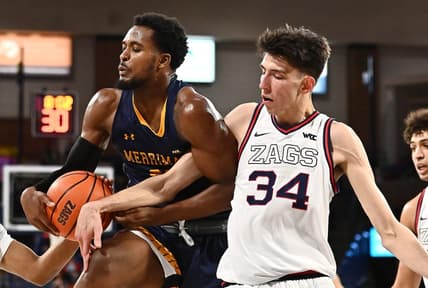 Dec 9, 2021; Spokane, Washington, USA; Merrimack Warriors forward Jordan Minor (22) rebounds the ball against Gonzaga Bulldogs center Chet Holmgren (34) in the second half at McCarthey Athletic Center. Gonzaga won 80-55. Mandatory Credit: James Snook-USA TODAY Sports