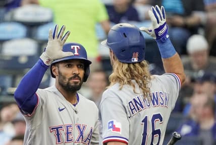Apr 17, 2023; Kansas City, Missouri, USA; Texas Rangers second baseman Marcus Semien (2) celebrates with right fielder Travis Jankowski (16) after hitting a solo home run against the Kansas City Royals in the third inning at Kauffman Stadium. Mandatory Credit: Denny Medley-USA TODAY Sports