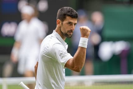 Jul 11, 2023; London, United Kingdom; Novak Djokovic (SRB) reacts to a point during his match against Andrey Rublev on day nine at the All England Lawn Tennis and Croquet Club. Mandatory Credit: Susan Mullane-USA TODAY Sports