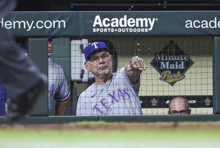 Jul 25, 2023; Houston, Texas, USA; Texas Rangers manager Bruce Bochy (15) throws seeds in the dugout after the results of a video review during the eighth inning against the Houston Astros at Minute Maid Park. Mandatory Credit: Troy Taormina-USA TODAY Sports