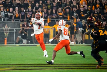Sep 9, 2023; Tempe, Arizona, USA; Oklahoma State Cowboys quarterback Alan Bowman (7) throws a to wide receiver Brennan Presley (80) against the Arizona State Sun Devils in the first half at Mountain America Stadium. Mandatory Credit: Rob Schumacher-Arizona Republic
