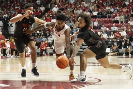 Nov 17, 2023; Tuscaloosa, Alabama, USA;  Alabama guard Aaron Estrada splits between Mercer forward TJ Grant (14) and Mercer guard Jah Quinones (0) at Coleman Coliseum. Mandatory Credit: Gary Cosby Jr.-USA TODAY Sports