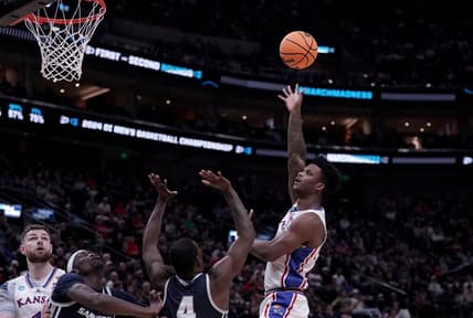 Mar 21, 2024; Salt Lake City, UT, USA; Kansas Jayhawks forward K.J. Adams Jr. (24) shoots against Samford Bulldogs forward Jermaine Marshall (4) during the second half in the first round of the 2024 NCAA Tournament at Vivint Smart Home Arena-Delta Center. Mandatory Credit: Gabriel Mayberry-USA TODAY Sports