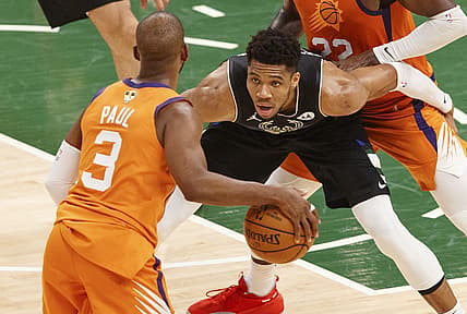 Jul 20, 2021; Milwaukee, Wisconsin, USA; Milwaukee Bucks forward Giannis Antetokounmpo (34) defends Phoenix Suns guard Chris Paul (3) during the second quarter during game six of the 2021 NBA Finals at Fiserv Forum. Mandatory Credit: Jeff Hanisch-USA TODAY Sports