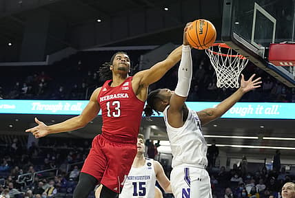 Feb 22, 2022; Evanston, Illinois, USA; Nebraska Cornhuskers forward Derrick Walker (13) and Northwestern Wildcats forward Elyjah Williams (21) go for a loose ball during the second half at Welsh-Ryan Arena. Mandatory Credit: David Banks-USA TODAY Sports