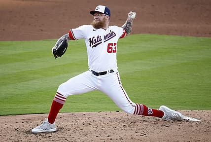 Mar 21, 2022; West Palm Beach, Florida, USA; Washington Nationals pitcher Sean Doolittle (63) pitches against the St. Louis Cardinals in the third inning during spring training at The Ballpark of the Palm Beaches. Mandatory Credit: Rhona Wise-USA TODAY Sports