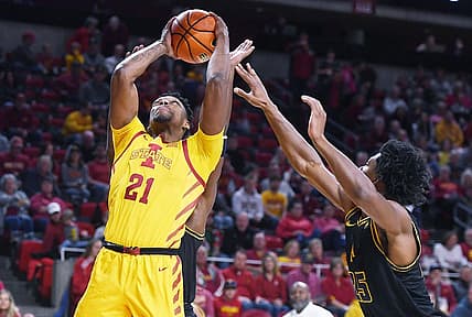 Iowa State University Cyclones center Osun Osunniyi (21) takes a shot around North Carolina A&T Aggies forward Webster Filmore (25) during the first half at Hilton Coliseum Sunday, Nov. 13, 2022, in Ames, Iowa.  Photo by Nirmalendu Majumdar/Ames Tribune

Ncaa Men S Basketball