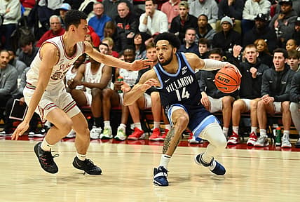 Dec 17, 2022; Philadelphia, Pennsylvania, USA; Villanova Wildcats guard Caleb Daniels (14) shields the ball from Saint Joseph's Hawks forward Louis Bleechmore (55) in the first half at Michael J. Hagan Arena. Mandatory Credit: Kyle Ross-USA TODAY Sports