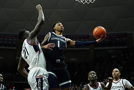 Dec 20, 2022; Storrs, Connecticut, USA; Georgetown Hoyas guard Primo Spears (1) shoots against UConn Huskies forward Adama Sanogo (21) in the second half at Harry A. Gampel Pavilion. Mandatory Credit: David Butler II-USA TODAY Sports