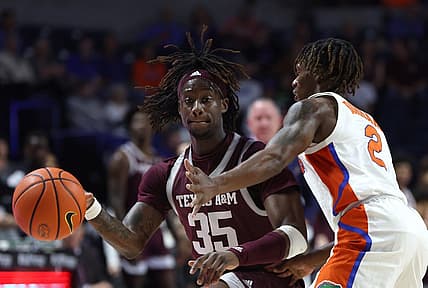 Jan 4, 2023; Gainesville, Florida, USA; Texas A&M Aggies guard Manny Obaseki (35) controls the ball while defended by Florida Gators guard Trey Bonham (2) during the first half at Exactech Arena at the Stephen C. O'Connell Center. Mandatory Credit: Kim Klement-USA TODAY Sports
